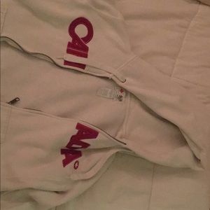 White zip up sweatshirt.